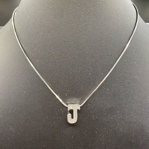 J initial with clear crystals in a silver chain.